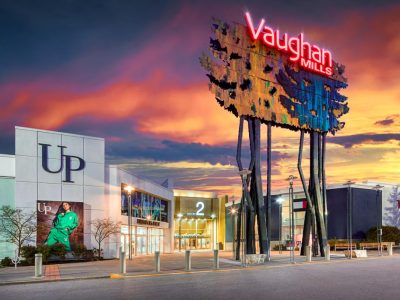 Entrance to Vaughan Mills shopping mall with UP fashion banner and colorful signage