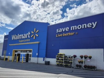 Exterior of Walmart Supercentre with blue walls and “save money. Live better.” slogan